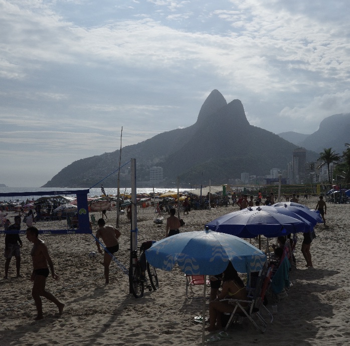Beachgoers and umbrellas on a busy beach in Rio de Janeiro